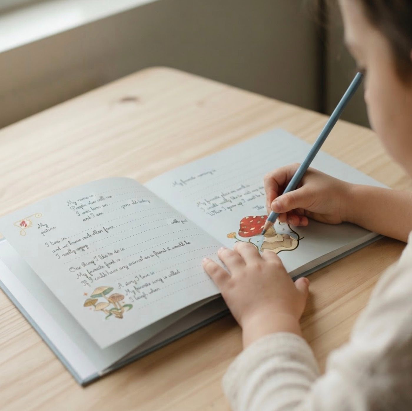 A child writing by hand in an open My Friends Book